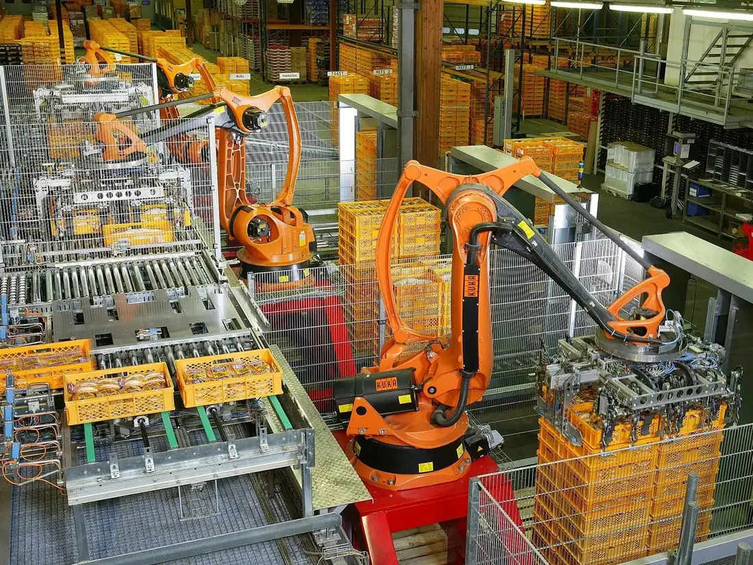Industrial robotic arms on a manufacturing line